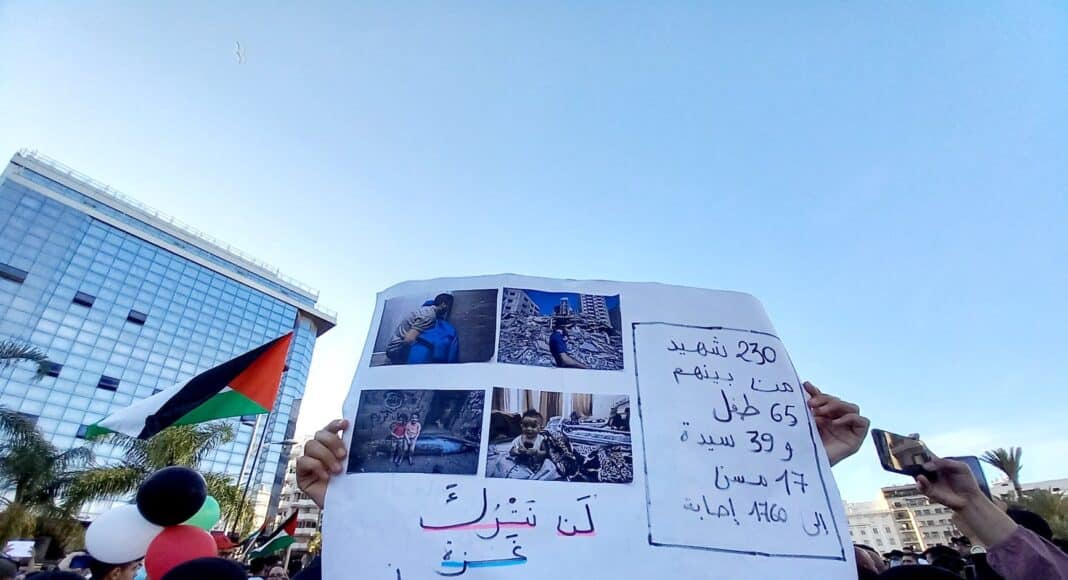 people holding white banner