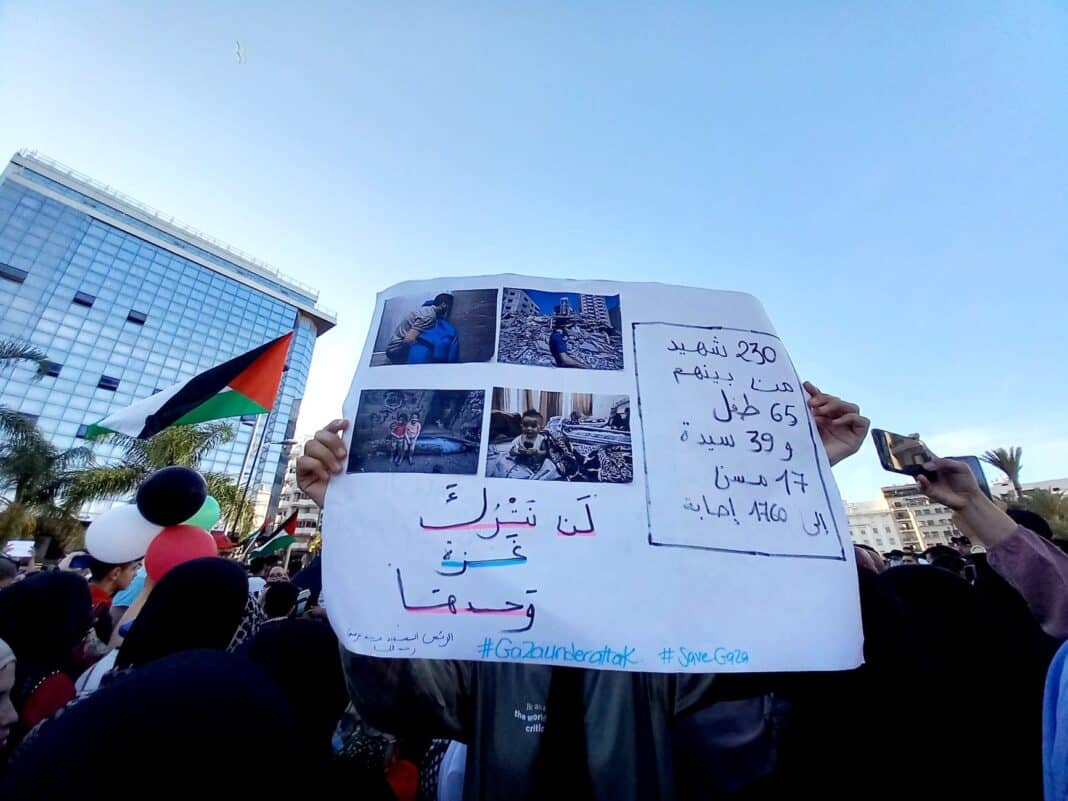 people holding white banner