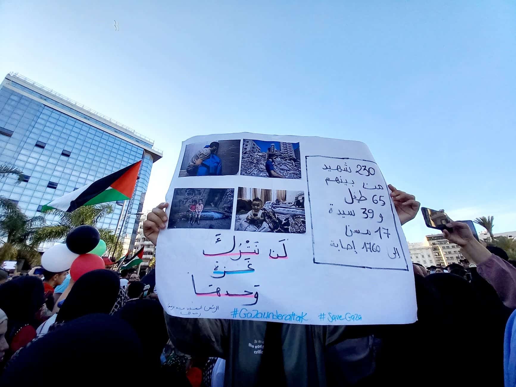 people holding white banner