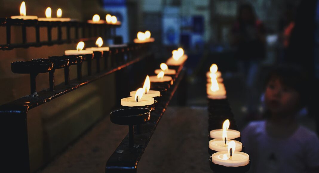 white tealight candles lit during nighttime