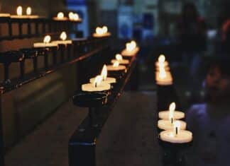 white tealight candles lit during nighttime