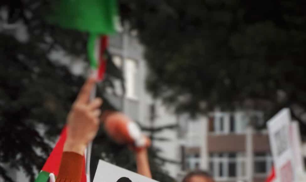 a sign that reads our voices will never be silenced israel