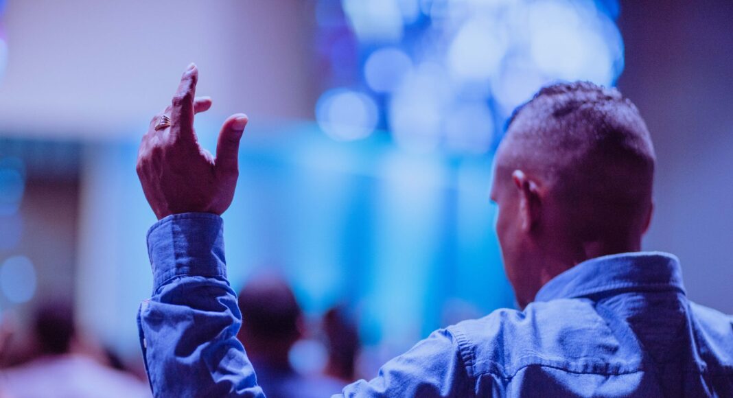 man wearing blue dress
