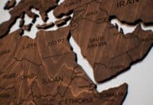 wooden puzzle pieces of a world map