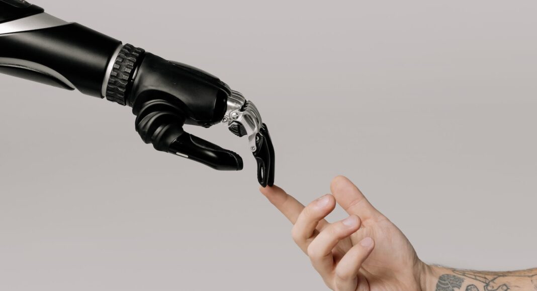 bionic hand and human hand finger pointing
