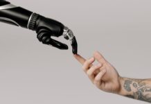 bionic hand and human hand finger pointing