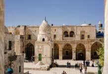people strolling at the ancient building