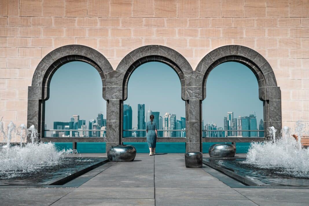 brown building with stonewall and arches