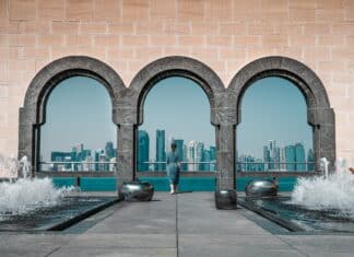 brown building with stonewall and arches