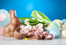 white flowers between brown rabbit figure and eggs