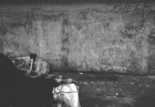 person wearing high top sneakers