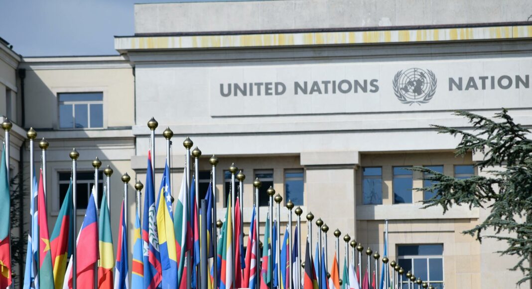 flags of countries in front of the united nations office at geneva