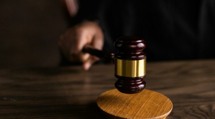 brown wooden gavel on brown wooden table