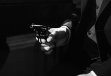 photo of person holding a handgun