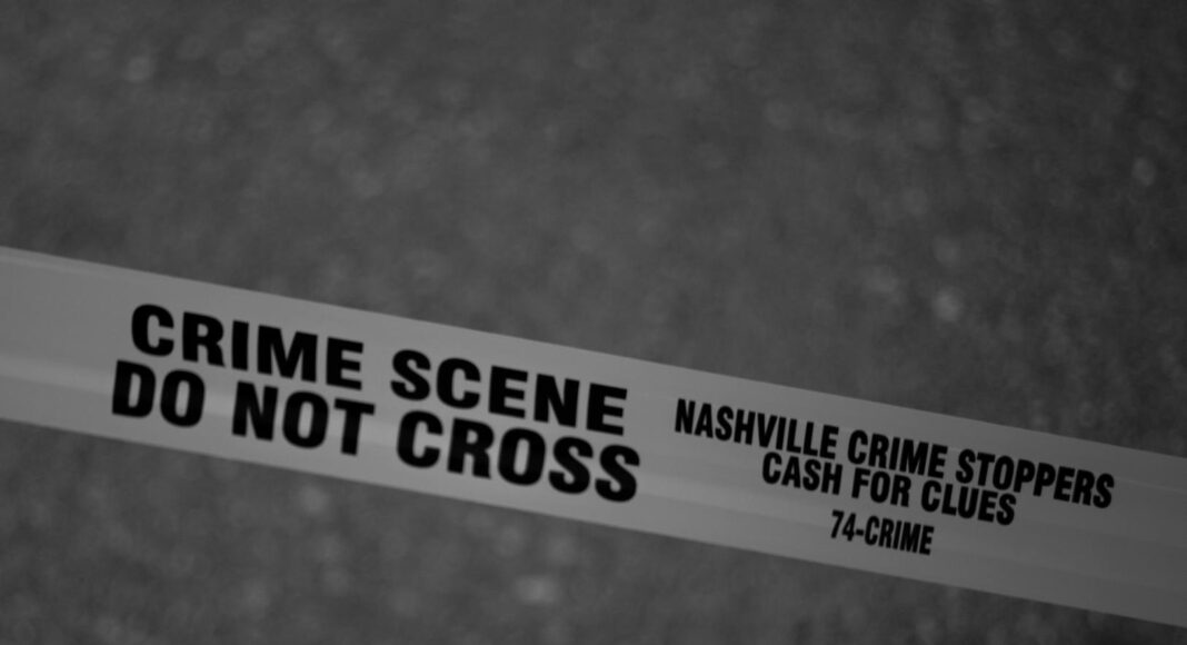 grayscale photo of crime scene do not cross tape