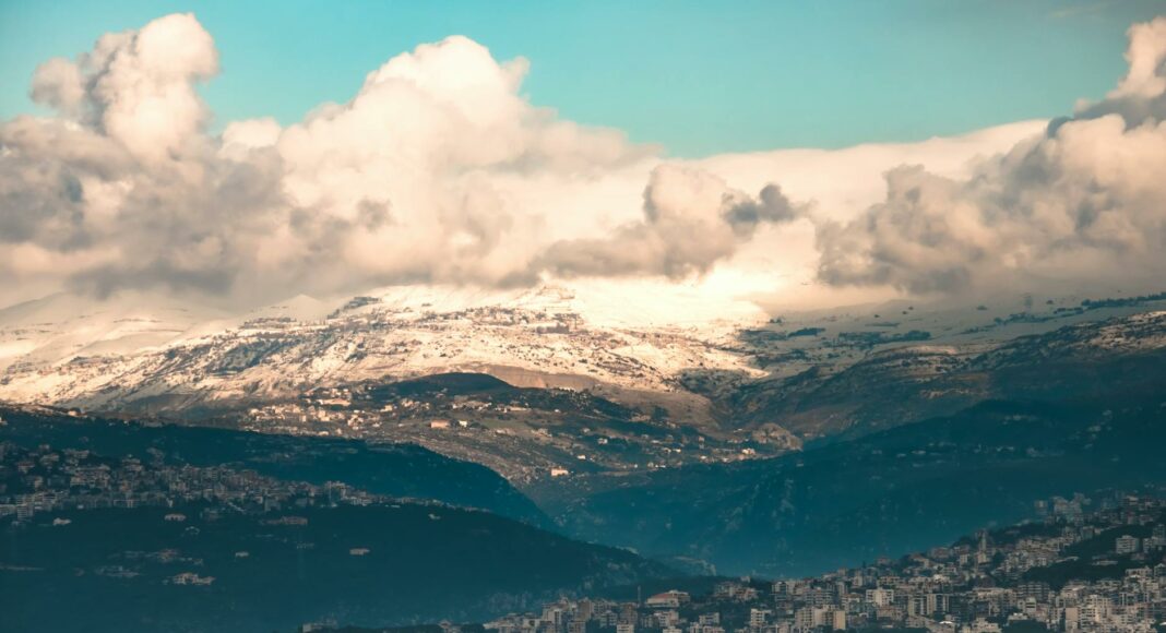aerial view of mountains surrounding city