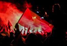 people gathering in a concert during night time