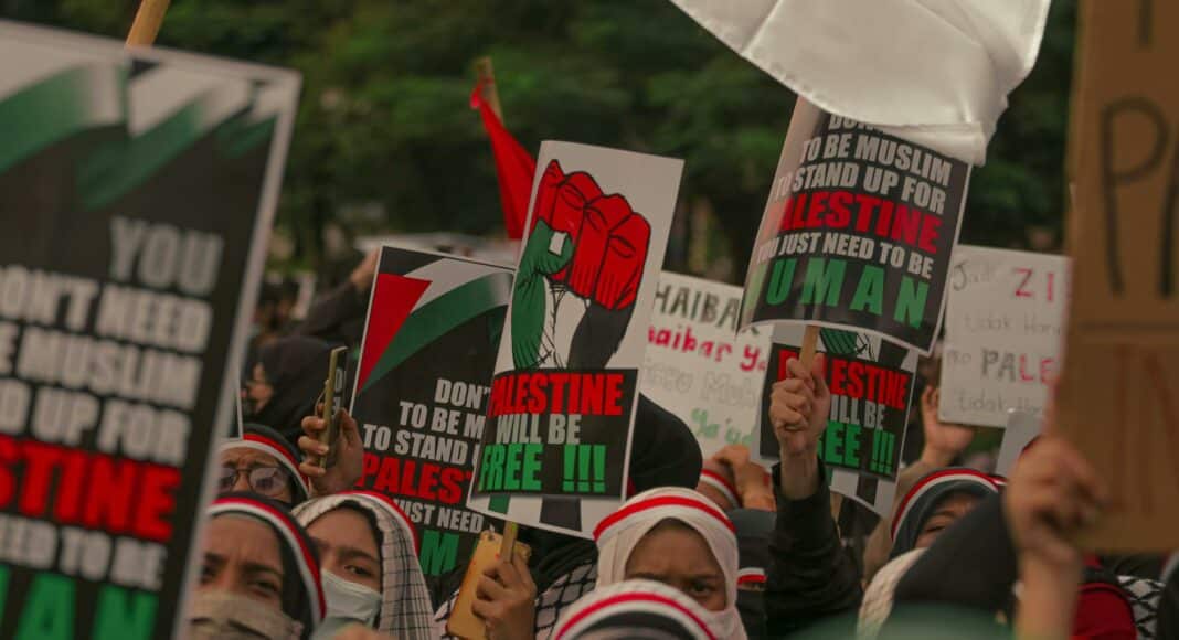 protesters holding posters during their rally