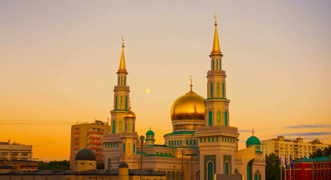 gold mosque during sunset