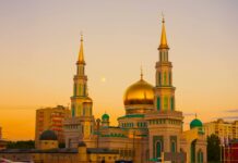 gold mosque during sunset