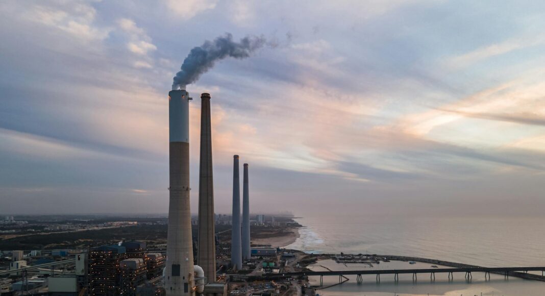 chimney smoking by sea