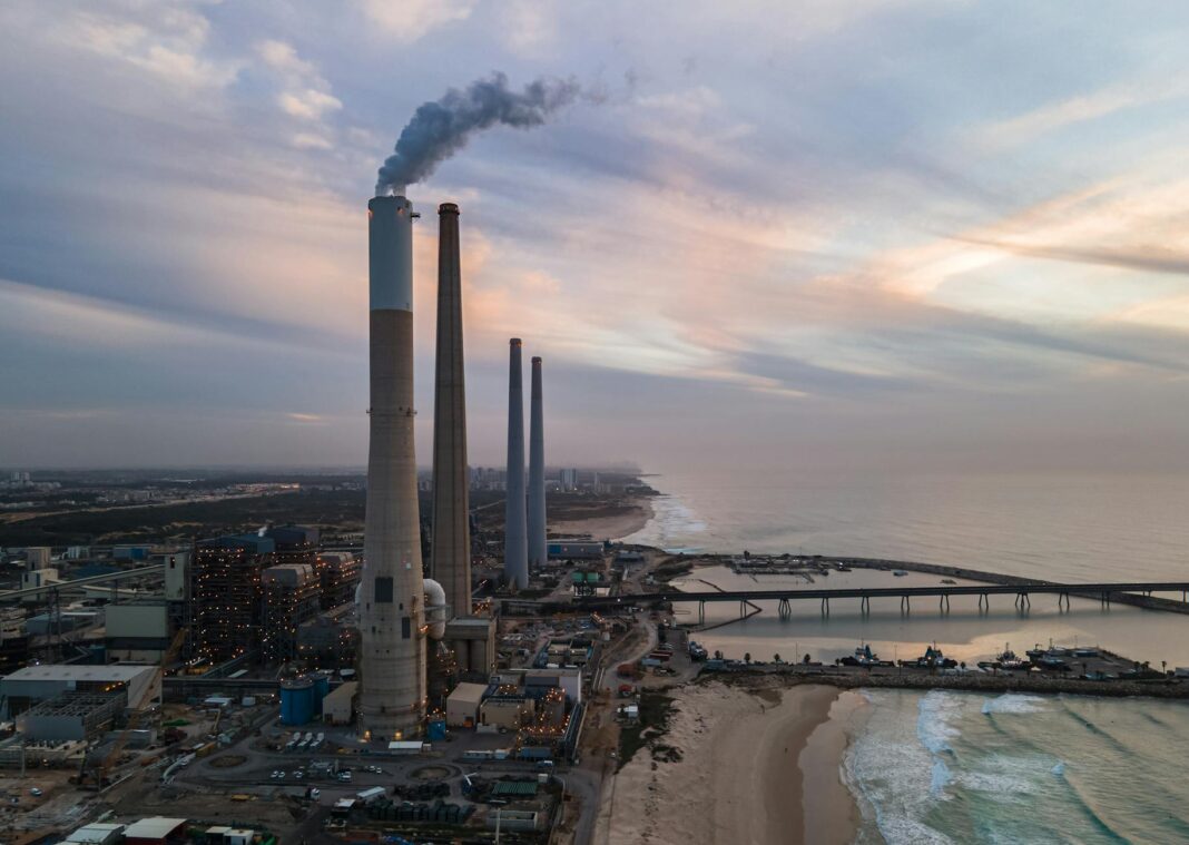chimney smoking by sea