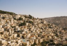 beige concrete buildings on high ground