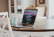 macbook on brown wooden table