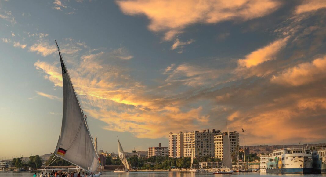 boats in harbor at sunset