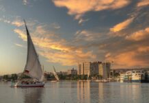 boats in harbor at sunset