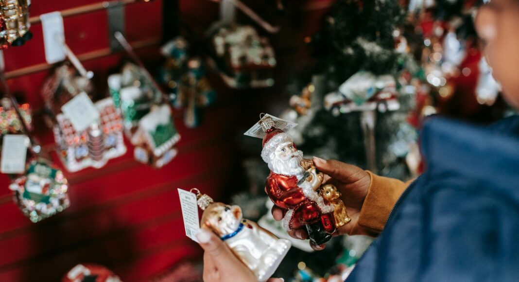 ethnic girl choosing toys for christmas tree