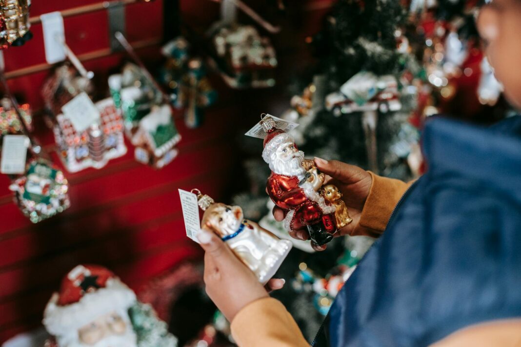 ethnic girl choosing toys for christmas tree