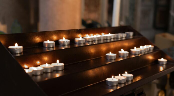 a wooden altar with lit candles on it