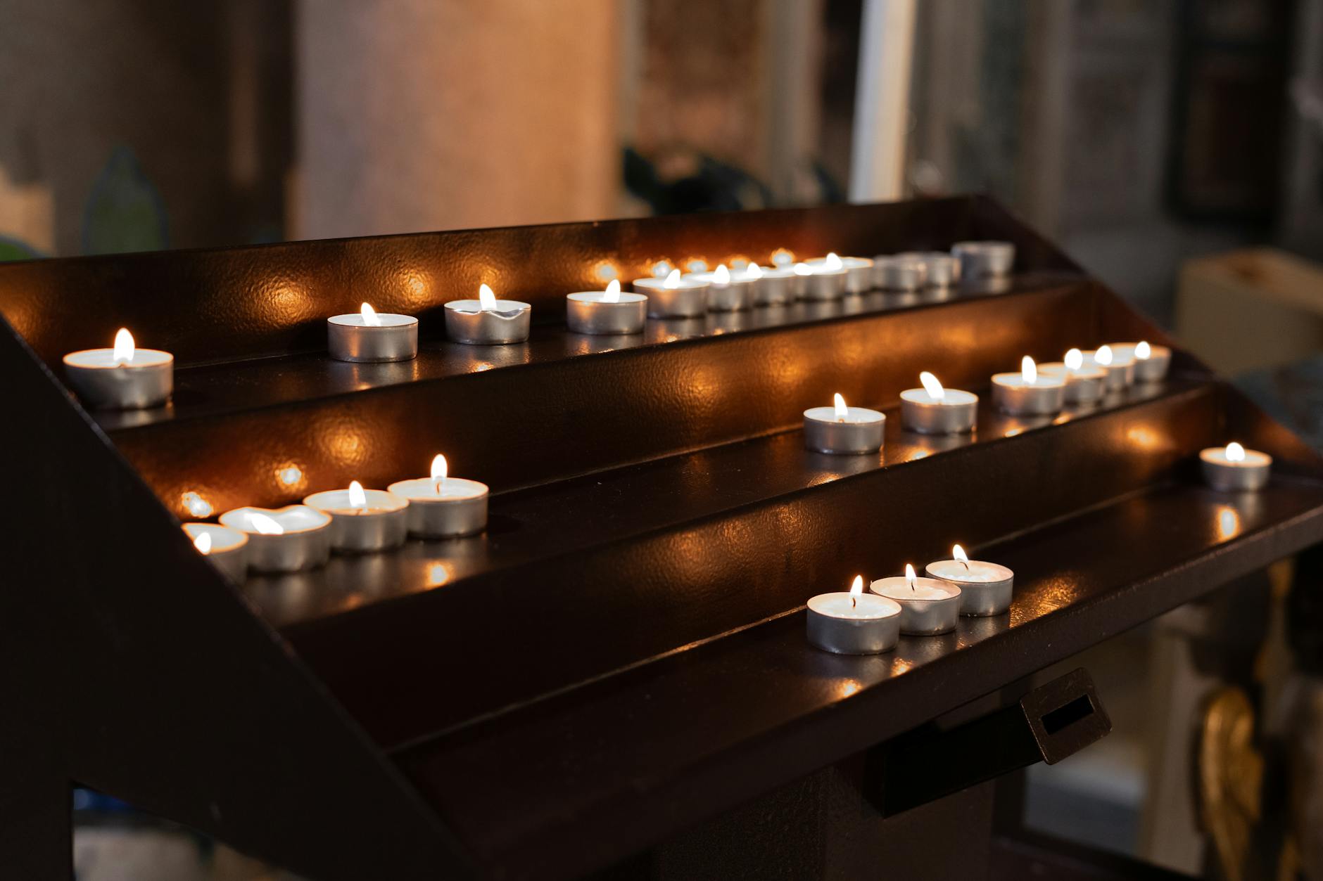 a wooden altar with lit candles on it