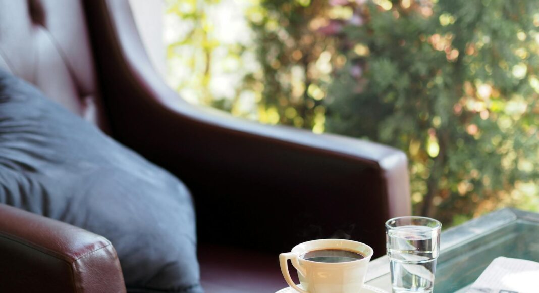 filled white coffee cup on saucer