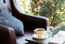 filled white coffee cup on saucer