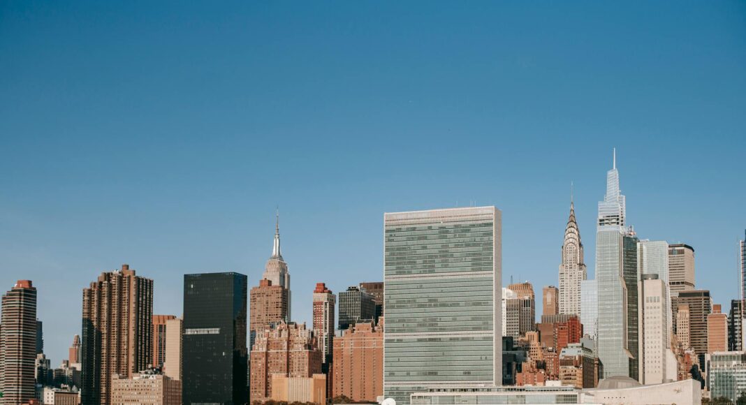 modern city with skyscrapers and residential buildings located near river