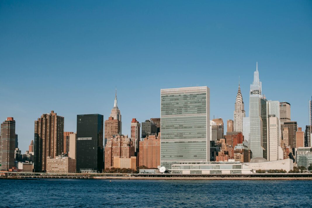 modern city with skyscrapers and residential buildings located near river