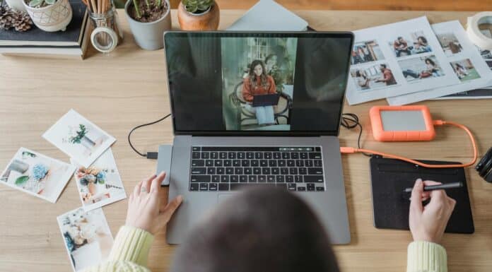 anonymous woman retouching photos on netbook