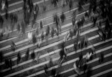time lapse photography of people walking on pedestrian lane