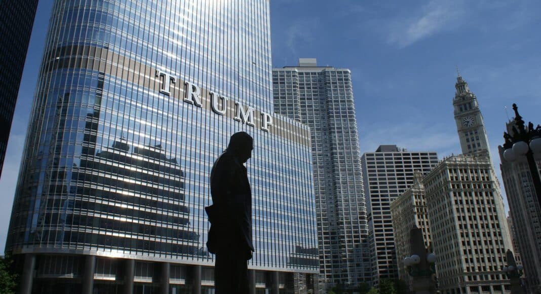 silhouette of statue near trump building at daytime