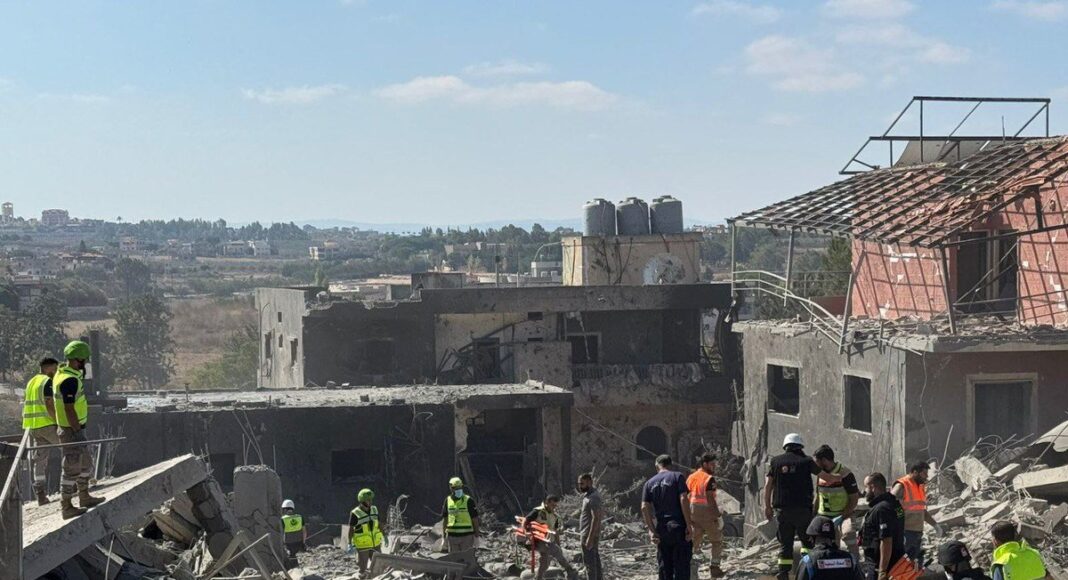 Destruction after an air raid on the town of Kafr Tibnit, south Lebanon