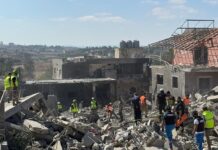 Destruction after an air raid on the town of Kafr Tibnit, south Lebanon