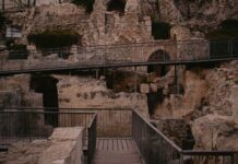 a stairway leading up to a cave like structure