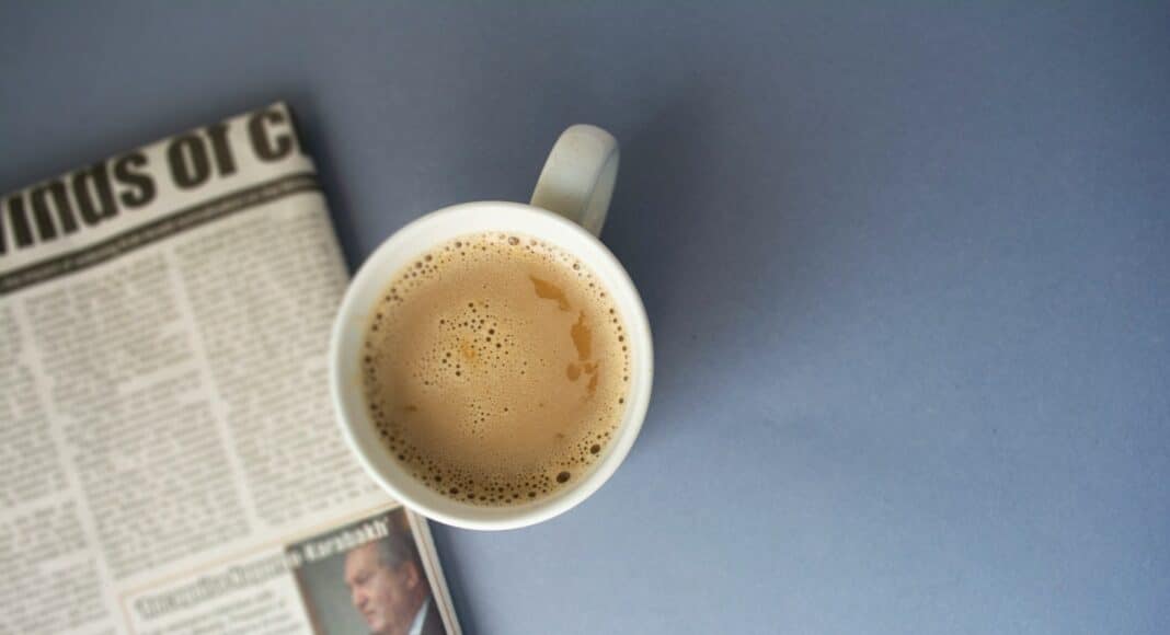 white ceramic mug on white table