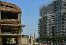 a very tall building sitting next to a very tall building