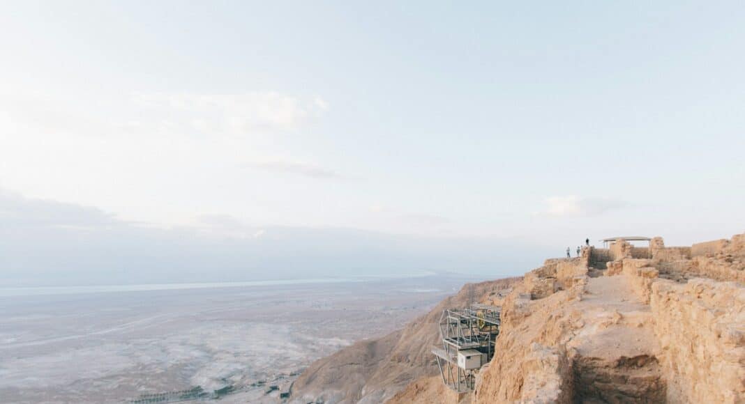 photo of gray and white construction on hill during daytime
