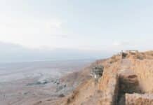 photo of gray and white construction on hill during daytime