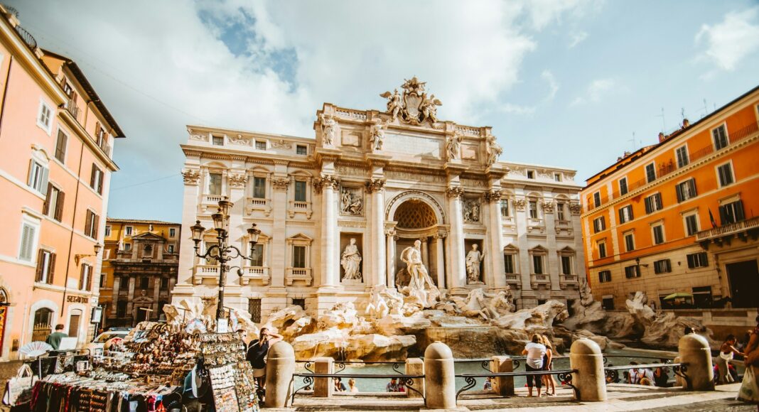 man standing in front of statue