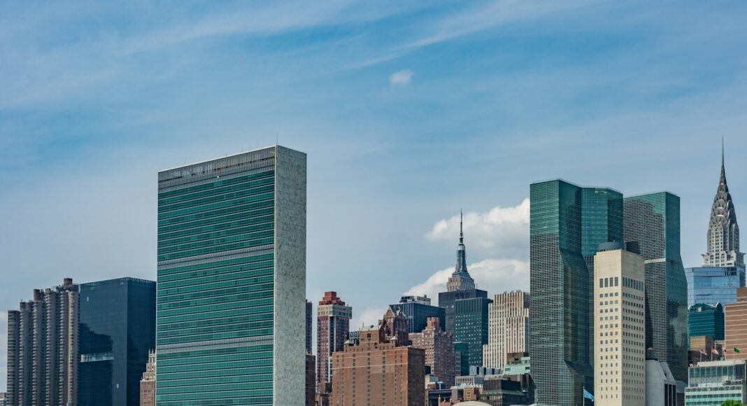 city buildings near body of water during daytime
